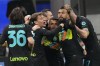 Inter Milan's Alexis Sanchez, center, celebrates with his teammates his goal against Roma during the Italian Cup soccer match between Inter Milan and Roma at the San Siro stadium, in Milan, Italy, on Tuesday, Feb. 8, 2022. (AP Photo/Antonio Calanni)