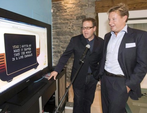 Eric Boyko, right, president and CEO of Stingray Digital Group, and Alexandre Taillefer, try their online karaoke website at the company's headquarters in Montreal Monday, Sept. 8, 2008. THE CANADIAN PRESS/Ryan Remiorz