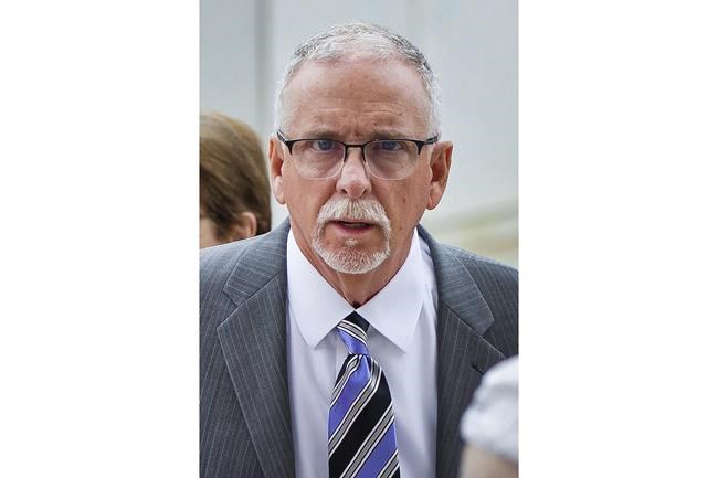 FILE - Former UCLA gynecologist James Heaps arrives at Los Angeles Superior Court, on June 26, 2019. A lawsuit alleging that the former UCLA gynecologist sexually abused hundreds of women has been settled for $246.3 million. The amount of the settlement was announced Tuesday, Feb. 8, 2022, by UCLA and some of the lawyers representing 203 women. (AP Photo/Damian Dovarganes, File)