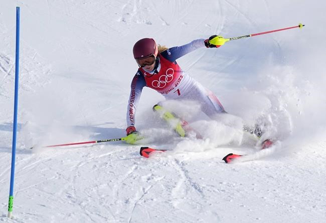 Mikaela Shiffrin, of the United States skis out in the first run of the women's slalom at the 2022 Winter Olympics, Wednesday, Feb. 9, 2022, in the Yanqing district of Beijing. (AP Photo/Robert F. Bukaty)