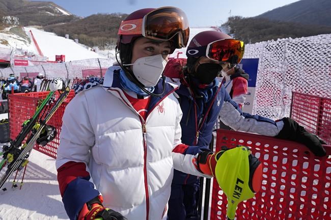 Mikaela Shiffrin, of the United States leaves the finish area after she skied out in the first run of the women's slalom at the 2022 Winter Olympics, Wednesday, Feb. 9, 2022, in the Yanqing district of Beijing. (AP Photo/Luca Bruno)