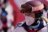 Mikaela Shiffrin, of the United States leaves the finish area after she skied out in the first run of the women's slalom at the 2022 Winter Olympics, Wednesday, Feb. 9, 2022, in the Yanqing district of Beijing. (AP Photo/Luca Bruno)