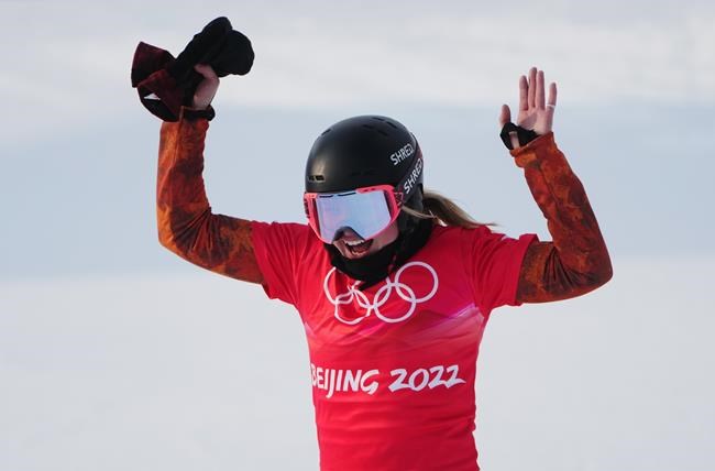 Canada's Meryeta Odine celebrates her bronze medal in the women's snowboard cross final at the 2022 Beijing Winter Olympics in Zhangjiakou, China on Wednesday, Feb. 9, 2022. THE CANADIAN PRESS/Sean Kilpatrick