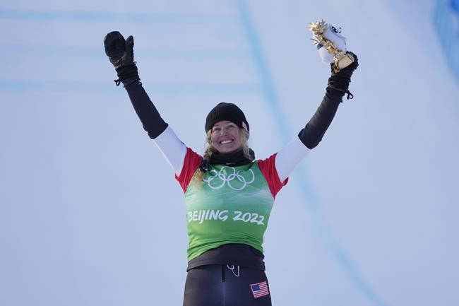 United States' Lindsey Jacobellis celebrates after winning a gold medal in the women's cross finals at the 2022 Winter Olympics, Wednesday, Feb. 9, 2022, in Zhangjiakou, China. (AP Photo/Lee Jin-man)