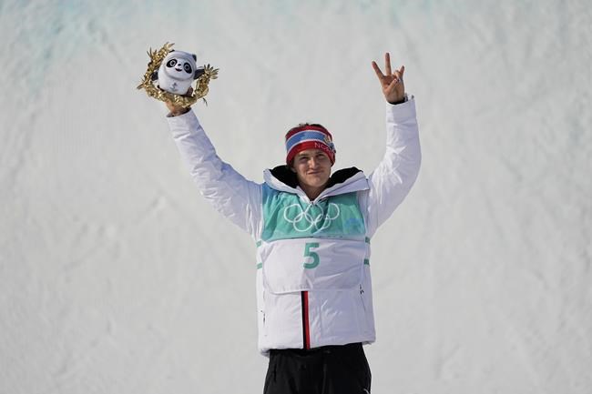 Gold medalist Birk Ruud of Norway poses during a venue ceremony for the men's freestyle skiing big air finals of the 2022 Winter Olympics, Wednesday, Feb. 9, 2022, in Beijing. (AP Photo/Ashley Landis)