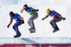 FILE - Glenn de Blois, of the Netherlands, from left, Nick Baumgartner of the United States, and Jakob Dusek of Austria compete during a semifinal of men's snowboard cross at the FIS Snowboard Cross World Cup, a test event for the 2022 Winter Olympics, at the Genting Resort Secret Garden in Zhangjiakou in northern China's Hebei Province, Nov. 28, 2021. On Thursday, Feb. 10, 2022, Baumgartner, 40, will kick off action at his fourth Olympics. (AP Photo/Mark Schiefelbein, File)