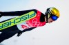 Vinzenz Geiger, of Germany, soars through the air during the ski jump portion of the individual Gundersen normal hill event at the 2022 Winter Olympics, Wednesday, Feb. 9, 2022, in Zhangjiakou, China. (AP Photo/Andrew Medichini)