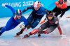 Canada's Charles Hamelin (right) slips during the men's 1,500-metre short-track speedskating semifinal at the Beijing Winter Olympics in Beijing, China, on Wednesday, Feb. 9, 2022. THE CANADIAN PRESS/Paul Chiasson