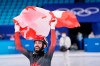 Canada's Steven Dubois celebrates after winning the silver medal in the men's 1,500-metre short-track speedskating event at the Beijing Winter Olympics in Beijing, China, on Wednesday, Feb. 9, 2022. THE CANADIAN PRESS/Paul Chiasson