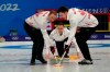 Canada skip Brad Gushue (centre) watches his shot as Geoff Walker (left) and Brett Gallant sweep during men's curling action against Denmark at the Beijing Winter Olympics in Beijing, China, on Wednesday, Feb. 9, 2022. THE CANADIAN PRESS/Ryan Remiorz