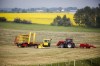 A farmer bales his hay crop, right, as a pick-wagon collects the bales with a canola field in the background near Cremona, Alta., Friday, July 16, 2021. Statistics Canada says the share of Canadians living in rural areas has declined for the ninth census in a row, dropping from 18.7 per cent in 2016 to 17.8 per cent in 2021.THE CANADIAN PRESS/Jeff McIntosh