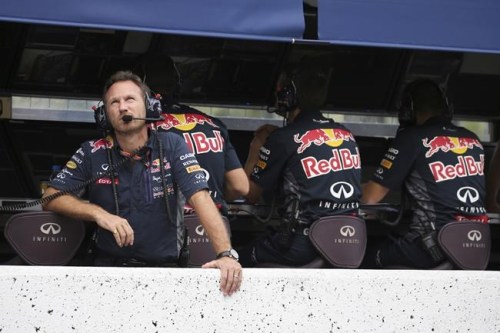 FILE - Red Bull Racing Team principal Christian Horner looks up during the qualifying session for the Japanese Formula One Grand Prix at the Suzuka Circuit in Suzuka, central Japan, Sept. 26, 2015. The Red Bull Formula One team has secured a new title sponsorship worth around $500 million with technology firm Oracle, placing it among the most lucrative commercial deals in sports. The five-year deal is a lift to the team ahead of the season beginning next month when Max Verstappen will be looking to defend his world title in a new Oracle Red Bull Racing car that was also revealed on Wednesday Feb. 9, 2022. (Yuriko Nakao/Pool via AP, file)