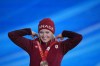 Meryeta O'Dine smiles as she accepts the bronze medal during a medal ceremony for the women's snowboard cross finals competition at the 2022 Winter Olympics, Wednesday, Feb. 9, 2022, in Zhangjiakou, China. THE CANADIAN PRESS/AP-Frank Augstein