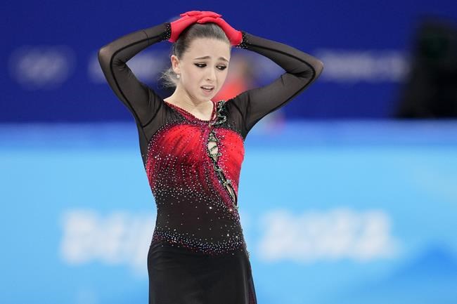 Kamila Valieva, of the Russian Olympic Committee, reacts after the women's team free skate program during the figure skating competition at the 2022 Winter Olympics, Monday, Feb. 7, 2022, in Beijing. (AP Photo/Natacha Pisarenko)