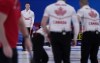 Canada's Brad Gushue directs his teammates as they sweep during the men's curling match against Norway, at the 2022 Winter Olympics, Thursday, Feb. 10, 2022, in Beijing. THE CANADIAN PRESS/AP/Nariman El-Mofty