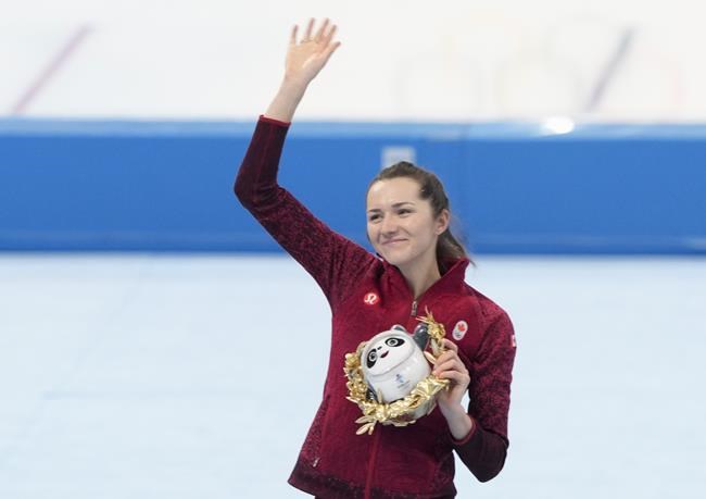 Canada's Isabelle Weidemann waves form the podium after winning the silver medal in the women's 5,000-metre speedskating final at the 2022 Winter Olympics in Beijing on Thursday, February 10, 2022. THE CANADIAN PRESS/Paul Chiasson