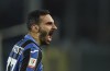 Atalanta's Davide Zappacosta celebrates after scoring during the Italian Cup soccer match between Atalanta and Fiorentina, at the Gewiss stadium in Bergamo, Italy, Thursday, Feb. 10, 2022. (Spada/LaPresse via AP)