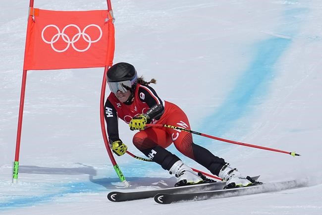 Marie-Michele Gagnon, of Canada makes a turn during the women's super-G at the 2022 Winter Olympics, Friday, Feb. 11, 2022, in the Yanqing district of Beijing. (AP Photo/Robert F. Bukaty)