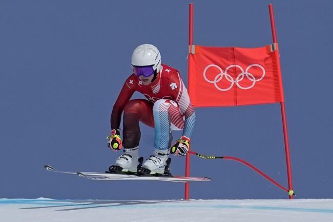 Lara Gut-Behrami, of Switzerland makes a jump during the women's super-G at the 2022 Winter Olympics, Friday, Feb. 11, 2022, in the Yanqing district of Beijing. (AP Photo/Robert F. Bukaty)