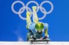 Jaclyn Narracott, of Australia, starts the women's skeleton run 2 at the 2022 Winter Olympics, Friday, Feb. 11, 2022, in the Yanqing district of Beijing. (AP Photo/Dmitri Lovetsky)