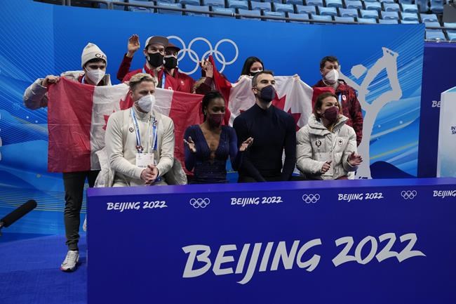 FILE - Vanessa James and Eric Radford, of Canada, react after the pairs team free skate program during the figure skating competition at the 2022 Winter Olympics, Feb. 7, 2022, in Beijing. In a century-old sport that had been largely European until just a few decades ago, some still wonder how more Black athletes can make a lasting imprint on competitive figure skating. “If you don’t see yourself in the sport, how can you believe that you belong, how can you believe that you can be the best, how do you know that you can be creative or that you’ll be accepted for your uniqueness?” James said. (AP Photo/Natacha Pisarenko, File)