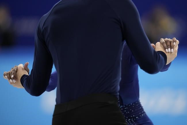 FILE - Vanessa James, back, and Eric Radford of Canada compete in the pairs team free skate program during the figure skating competition at the 2022 Winter Olympics, Feb. 7, 2022, in Beijing. In a century-old sport that had been largely European until just a few decades ago, some still wonder how more Black athletes can make a lasting imprint on competitive figure skating. “If you don’t see yourself in the sport, how can you believe that you belong, how can you believe that you can be the best, how do you know that you can be creative or that you’ll be accepted for your uniqueness?” James said. (AP Photo/Natacha Pisarenko, File)