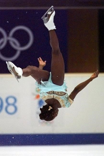 FILE - France's Surya Bonaly performs a back flip during her free skate program at White Ring Arena Friday, Feb. 20, 1998, in Nagano, Japan. The thrilling move has neither been widely attempted since nor accepted by judges for international competitions, such as the Olympic Games, and thus “the Bonaly flip” has never became a big thing. (AP Photo/Eric Draper, File)