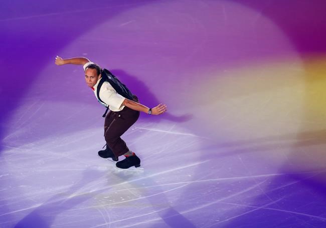 FILE - Elladj Balde of Canada performs during the gale exhibition of the NHK Trophy figure skating in Osaka, western Japan, Sunday, Nov. 30, 2014. Balde’s unconventional, hip-hop-inflected dancing style has gone viral on social media in recent years, allowing him to leverage the notoriety to push for both change and diversity. (AP Photo/Shizuo Kambayashi, File)