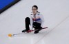 South Korea's Kim Eun-jung, directs her teammates, during the women's curling match against Canada, at the 2022 Winter Olympics, Thursday, Feb. 10, 2022, in Beijing. (AP Photo/Nariman El-Mofty)