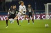 Rennes' Baptiste Santamaria, left, challenges for the ball with PSG's Xavi Simons during the French League One soccer match between Paris Saint Germain and Rennes at the Parc des Princes stadium in Paris, Friday, Feb. 11, 2022. (AP Photo/Michel Euler)