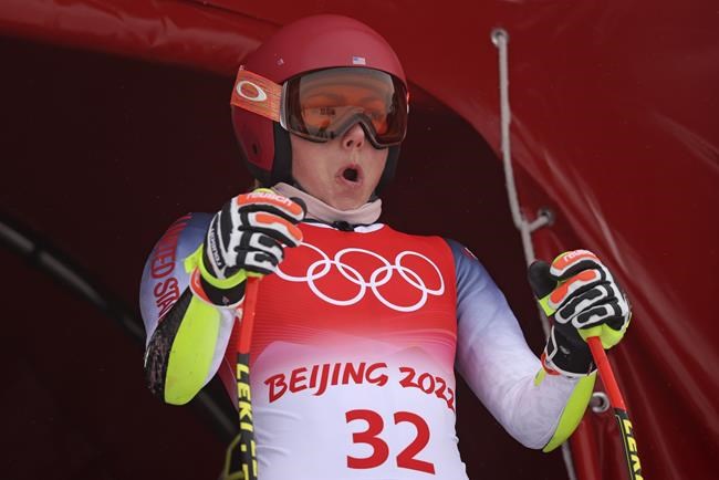 Mikaela Shiffrin of United States at the start of women's downhill training at the 2022 Winter Olympics, Saturday, Feb. 12, 2022, in the Yanqing district of Beijing. (AP Photo/Alessandro Trovati)