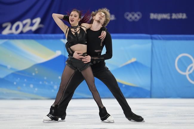Diana Davis and Gleb Smolkin, of the Russian Olympic Committee, perform their routine in the ice dance competition during figure skating at the 2022 Winter Olympics, Saturday, Feb. 12, 2022, in Beijing. (AP Photo/Natacha Pisarenko)