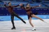Gabriella Papadakis and Guillaume Cizeron, of France, perform their routine in the ice dance competition during figure skating at the 2022 Winter Olympics, Saturday, Feb. 12, 2022, in Beijing. (AP Photo/Bernat Armangue)