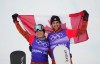 Canada's Meryeta O'Dine and Eliot Grondin celebrate their bronze medal in mixed team snowboard cross at the 2022 Beijing Winter Olympics in Zhangjiakou, China on Saturday, Feb. 12, 2022. THE CANADIAN PRESS/Sean Kilpatrick