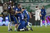 Chelsea players celebrate after the Club World Cup final soccer match between Palmeiras and Chelsea at Mohammed Bin Zayed Stadium in Abu Dhabi, United Arab Emirates, Saturday, Feb. 12, 2022. (AP Photo/Hassan Ammar)