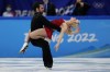 Olivia Smart and Adrian Diaz, of Spain, perform their routine in the ice dance competition during figure skating at the 2022 Winter Olympics, Saturday, Feb. 12, 2022, in Beijing. (AP Photo/Bernat Armangue)