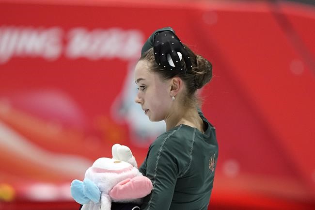 Kamila Valieva, of the Russian Olympic Committee, leaves the ice after a training session at the 2022 Winter Olympics, Sunday, Feb. 13, 2022, in Beijing. (AP Photo/David J. Phillip)