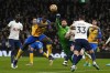 Tottenham's goalkeeper Hugo Lloris challenges for the ball with Southampton's Mohammed Salisu during the English Premier League soccer match between Tottenham Hotspur and Southampton at the Tottenham Hotspur Stadium in London, Wednesday, Feb. 9, 2022. (AP Photo/Alastair Grant)