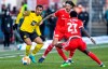 Borussia Dortmund's Donyell Malen, left, fights for the ball with Berlin's Christopher Trimmel and Sheraldo Becker, foregeround, during the German Bundesliga soccer match between Union Berlin and Borussia Dortmund, in Berlin, Sunday, Feb. 13, 2022. (Andreas Gora/dpa via AP)