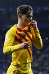 Barcelona's Pablo Gaviria celebrates after scoring his side's second goal during a Spanish La Liga soccer match between RCD Espanyol and Barcelona at the Cornella-El Prat stadium in Barcelona, Spain, Sunday, Feb. 13, 2022. (AP Photo/Joan Monfort)