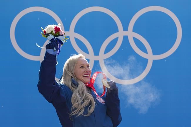 Kaillie Humphries, of the United States, celebrates winning the gold medal in the women's monobob at the 2022 Winter Olympics, Monday, Feb. 14, 2022, in the Yanqing district of Beijing. THE CANADIAN PRESS/AP-Mark Schiefelbein