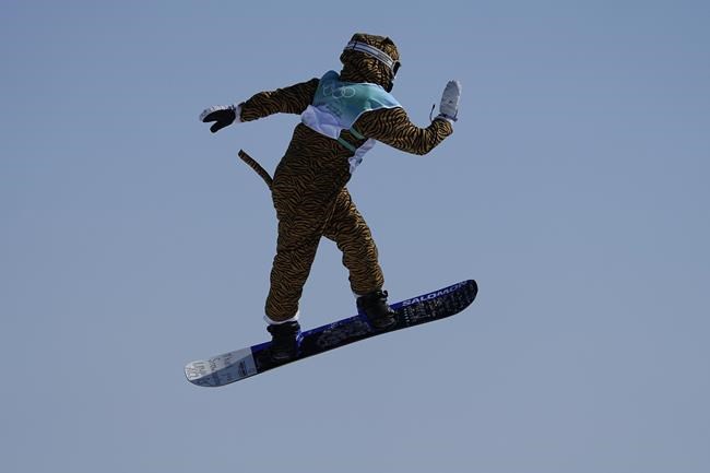 Lucile Lefevre of France competes during the women's snowboard big air qualifications of the 2022 Winter Olympics, Monday, Feb. 14, 2022, in Beijing. (AP Photo/Jae C. Hong)