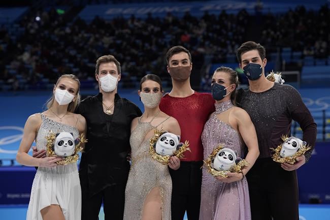 From left, silver medal finishers Victoria Sinitsina and Nikita Katsalapov, of the Russian Olympic Committee, gold medal finishers Gabriella Papadakis and Guillaume Cizeron, of France, and bronze medal finishers Madison Hubbell and Zachary Donohue, of the United States, pose during a venue ceremony after the ice dance competition during the figure skating at the 2022 Winter Olympics, Monday, Feb. 14, 2022, in Beijing. (AP Photo/David J. Phillip)