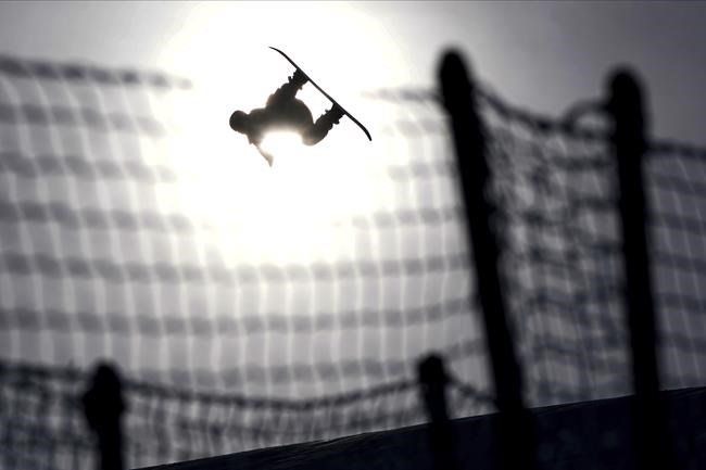 China's Su Yiming competes during men's slopestyle finals at the 2022 Winter Olympics, Monday, Feb. 7, 2022, in Zhangjiakou, China. (AP Photo/Gregory Bull)
