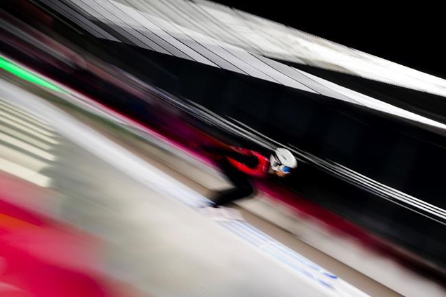 Matthew Soukup, of Canada, speeds down the hill during a men's large hill training session at the 2022 Winter Olympics, Thursday, Feb. 10, 2022, in Zhangjiakou, China. (AP Photo/Matthias Schrader)