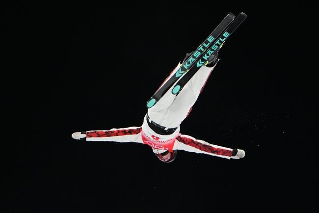 Marion Thenault of Canada soars on her second jump as she competes in the women's freestyle skiing aerials finals at the Beijing Winter Olympic Games, in Zhangjiakou, China, Monday, Feb. 14, 2022. THE CANADIAN PRESS/Sean Kilpatrick