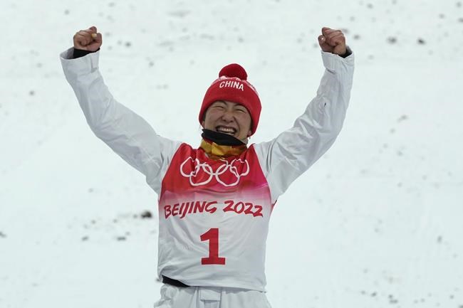 Gold medal winner China's Xu Mengtao celebrates during the venue award ceremony for competes during the women's aerials finals at the 2022 Winter Olympics, Monday, Feb. 14, 2022, in Zhangjiakou, China. (AP Photo/Francisco Seco)