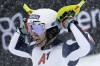 FILE - Britain's Dave Ryding celebrates at the finish area of an alpine ski, men's World Cup slalom, in Kitzbuehel, Austria, Saturday, Jan. 22, 2022. When David Ryding gets to the start gate of the men's slalom at the Beijing Games on Wednesday, he knows expectations of a British skier will be high for once. Ryding became the first British winner in the 55-year history of the Alpine skiing World Cup, and on one of the circuit's most challenging slalom courses, when he triumphed in Kitzbühel last month. Now the 35-year-old is bidding to end his country's lengthy wait for a first Olympic medal in Alpine skiing. (AP Photo/Giovanni Auletta, File)