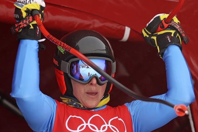 Federica Brignone of Italy at the start of women's downhill training at the 2022 Winter Olympics, Saturday, Feb. 12, 2022, in the Yanqing district of Beijing. (AP Photo/Alessandro Trovati)