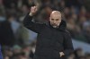 Manchester City's head coach Pep Guardiola gestures during the English Premier League soccer match between Manchester City and Brentford at the City of Manchester Stadium in Manchester, England, Wednesday, Feb. 9, 2022. (AP Photo/Jon Super)